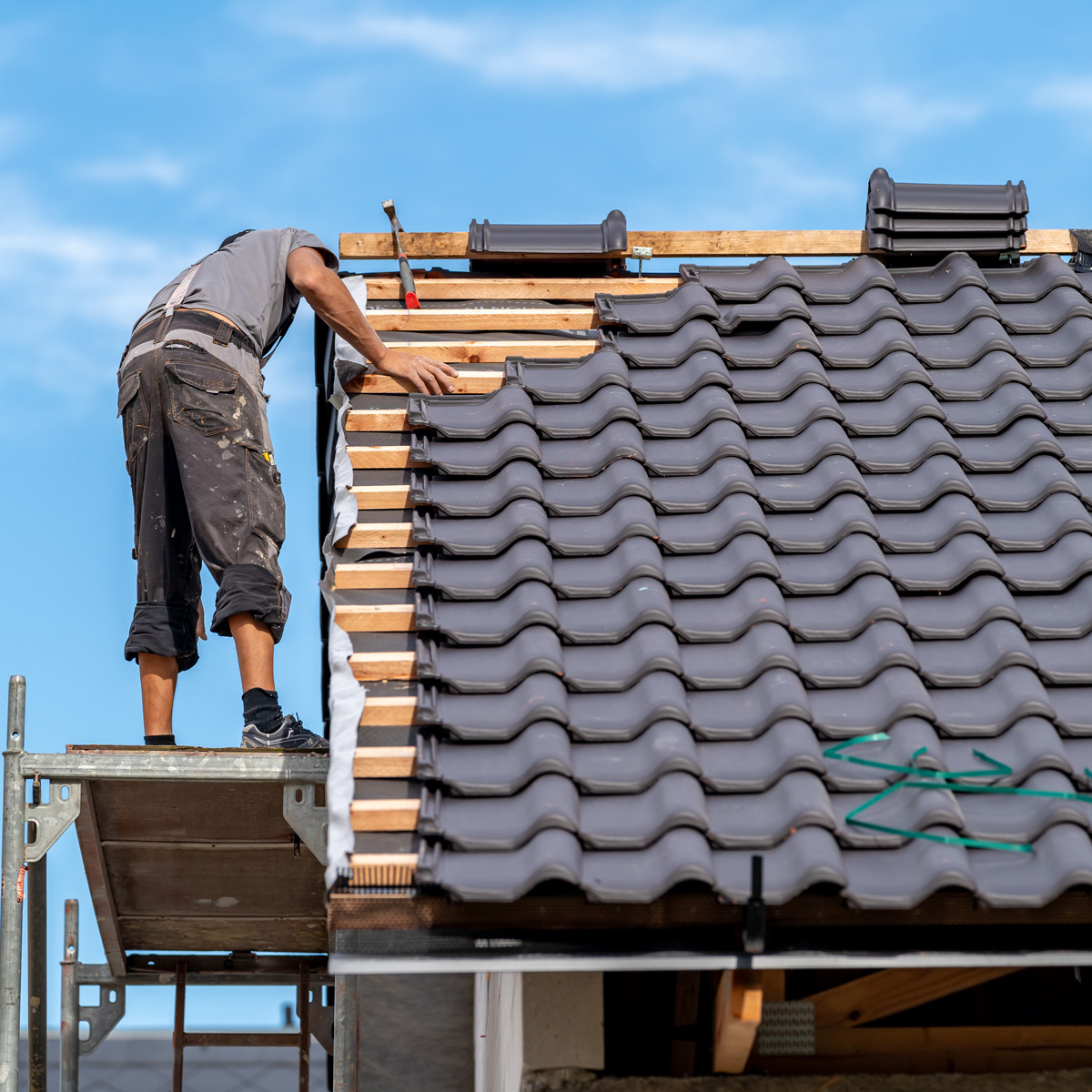 roofers working on roof replacement